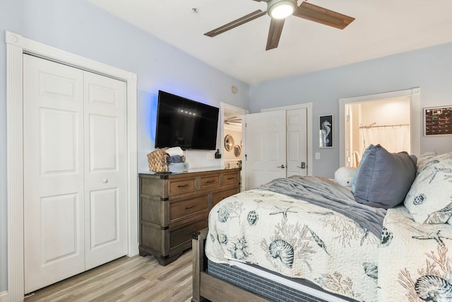 bedroom featuring ceiling fan, ensuite bathroom, and light hardwood / wood-style flooring