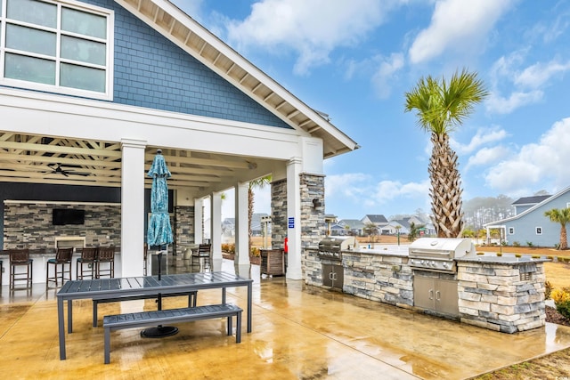 view of patio / terrace with a gazebo, area for grilling, exterior kitchen, and ceiling fan