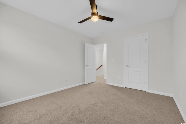 unfurnished bedroom featuring carpet floors and ceiling fan