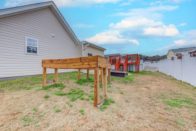 view of yard with a wooden deck