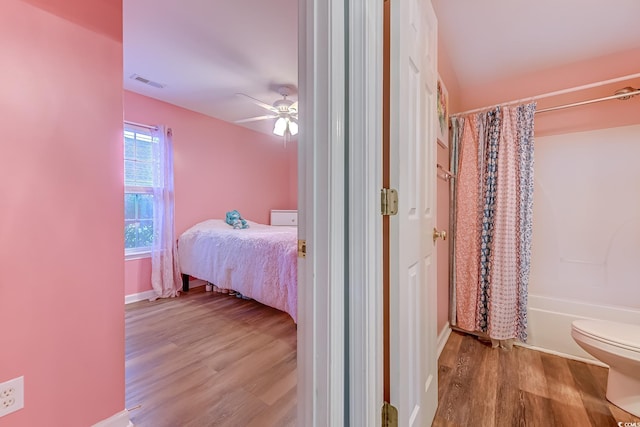 bedroom with ceiling fan and light wood-type flooring