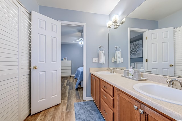 920 Leather Leaf Ln, Longs, SC 29568 - full bath featuring wood finished floors, double vanity, ceiling fan, and ensuite bathroom