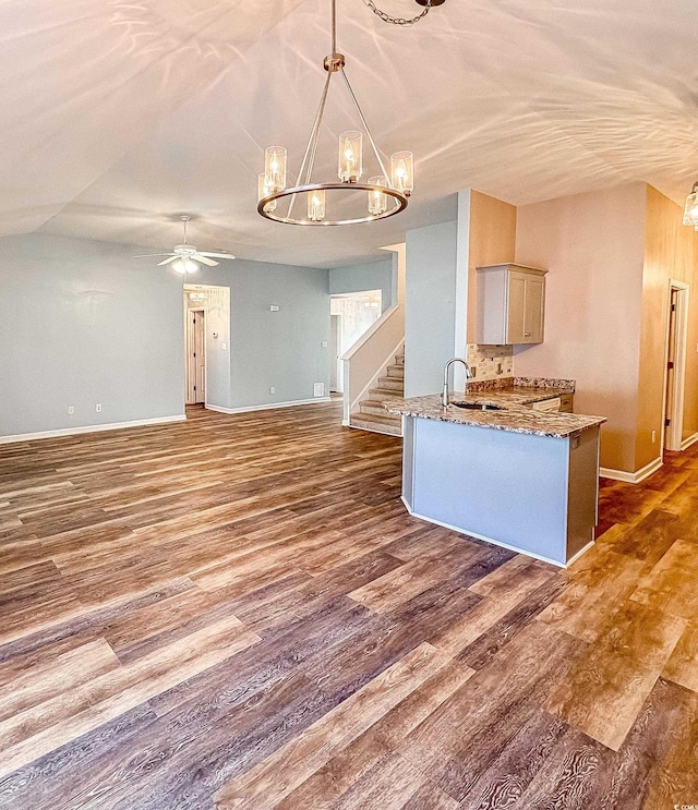 920 Leather Leaf Ln, Longs, SC 29568 - kitchen featuring a chandelier, baseboards, dark wood-type flooring, a ceiling fan, and vaulted ceiling