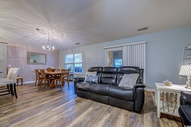 920 Leather Leaf Ln, Longs, SC 29568 - living area featuring a chandelier, wood finished floors, and baseboards