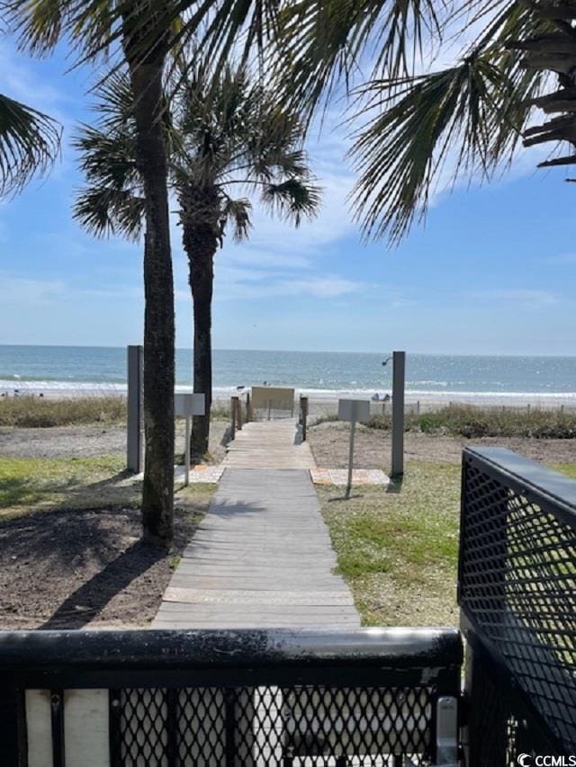 exterior space featuring a water view and a view of the beach