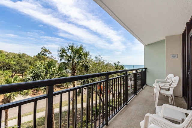 balcony featuring a water view