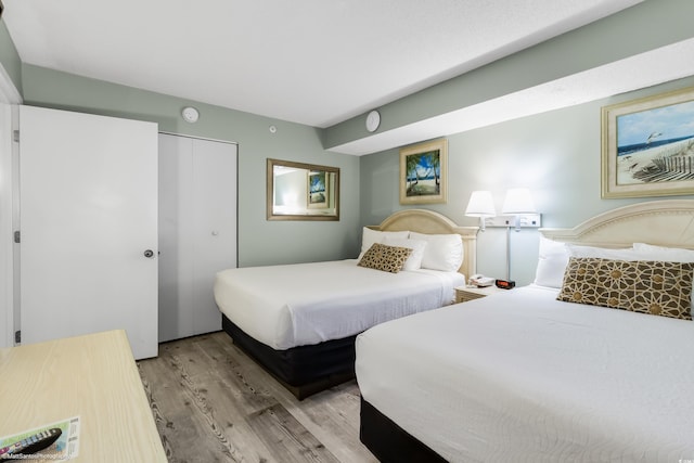 bedroom featuring a closet and light hardwood / wood-style flooring