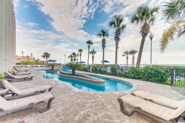 view of pool featuring a patio and a community hot tub