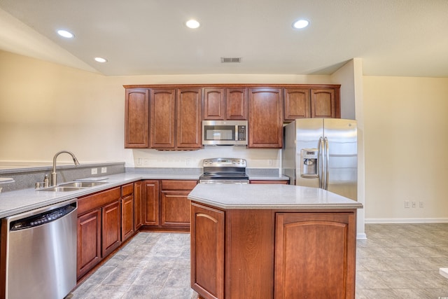 kitchen featuring visible vents, stainless steel appliances, light countertops, a sink, and recessed lighting