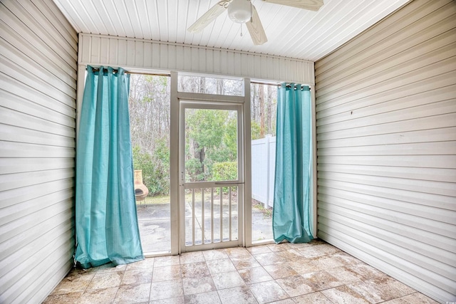 interior space with ceiling fan