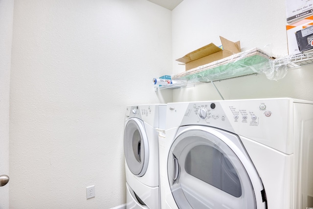 laundry area featuring laundry area and washing machine and dryer