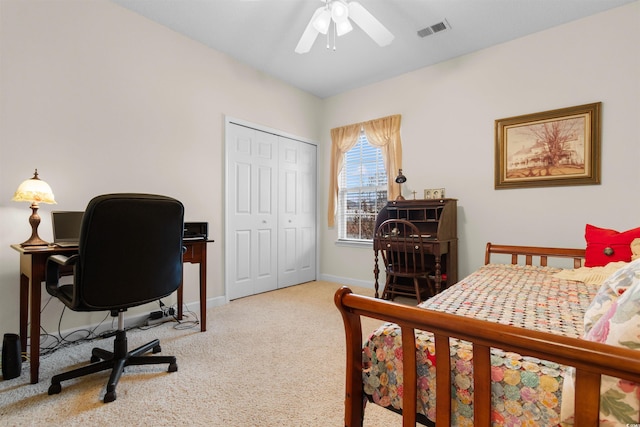 carpeted bedroom with a closet and ceiling fan