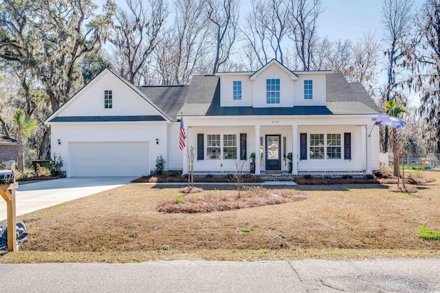 view of front of property featuring a garage and a porch