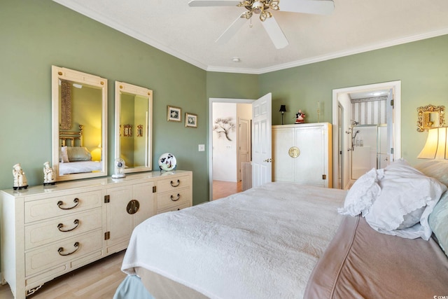 bedroom featuring ensuite bath, light hardwood / wood-style flooring, ornamental molding, and ceiling fan