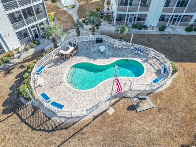 view of swimming pool featuring a patio area