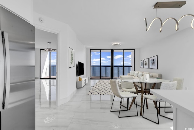 dining room with a wall of windows