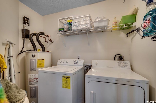 8545 Hopkins Cir Unit G, Myrtle Beach, SC 29575 - washroom with laundry area, a textured ceiling, washer and dryer, and electric water heater