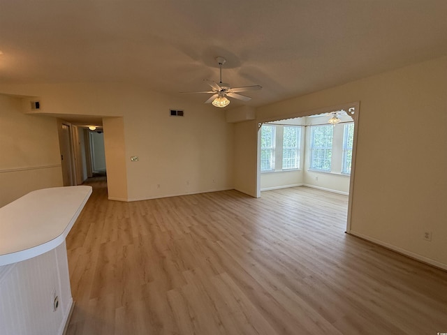 8545 Hopkins Cir Unit G, Myrtle Beach, SC 29575 - unfurnished living room featuring light wood-type flooring, baseboards, ceiling fan, and visible vents