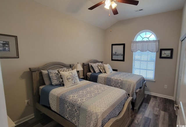 bedroom with lofted ceiling, dark hardwood / wood-style flooring, and ceiling fan