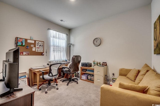 carpeted office space featuring visible vents