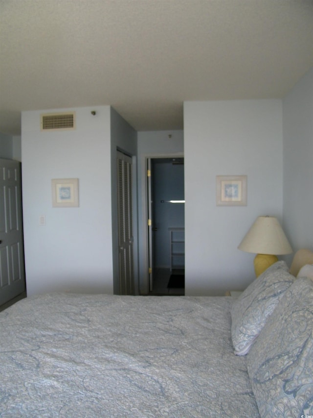 bedroom featuring visible vents