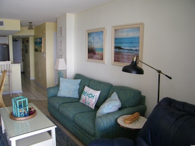 living room with tile patterned flooring and visible vents