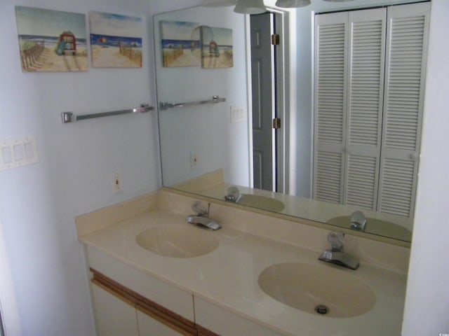 bathroom with double vanity and a sink