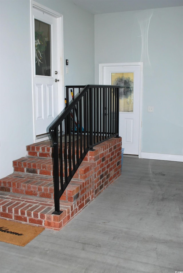 stairs featuring baseboards and wood finished floors