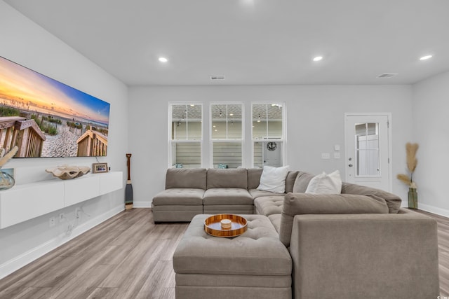 living room with light hardwood / wood-style flooring