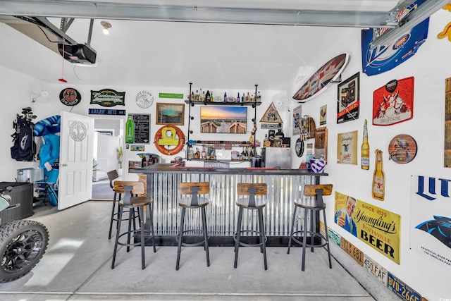 bar featuring concrete floors