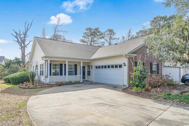 view of front of home featuring a garage and covered porch