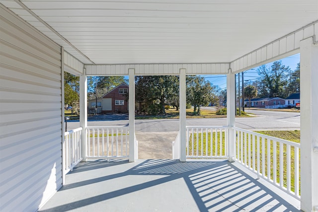 unfurnished sunroom with a residential view