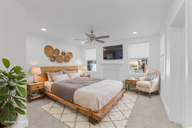 bedroom featuring light carpet, multiple windows, a ceiling fan, and recessed lighting