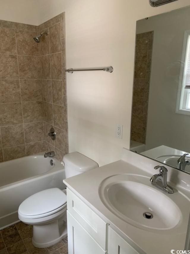 full bathroom featuring toilet, vanity, and shower / bathing tub combination