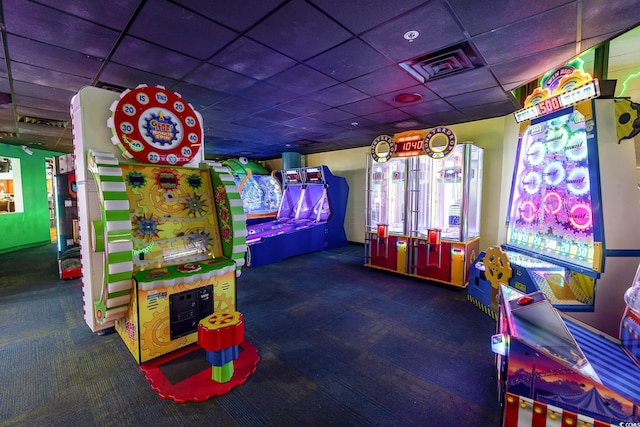 rec room featuring carpet and a paneled ceiling