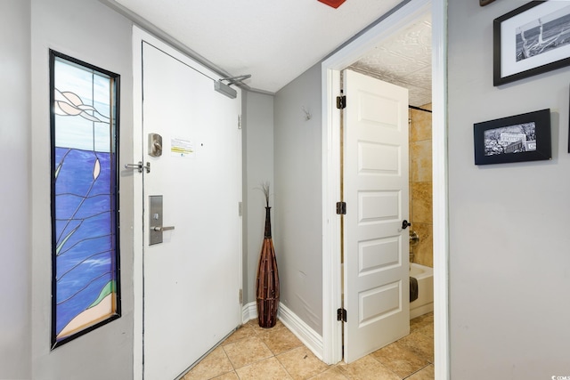 4800 S Ocean Blvd Unit 1514, North Myrtle Beach, SC 29582 - corridor featuring light tile patterned floors and baseboards
