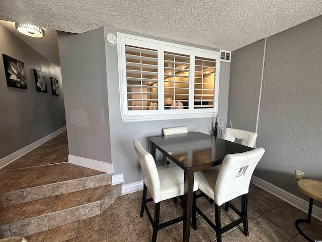 4800 S Ocean Blvd Unit 1514, North Myrtle Beach, SC 29582 - dining area with a textured ceiling and baseboards