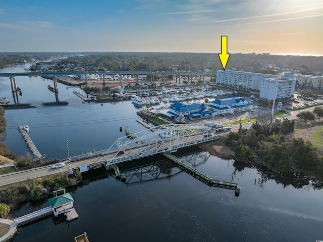 aerial view at dusk with a water view