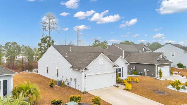 view of front facade featuring cooling unit and a garage