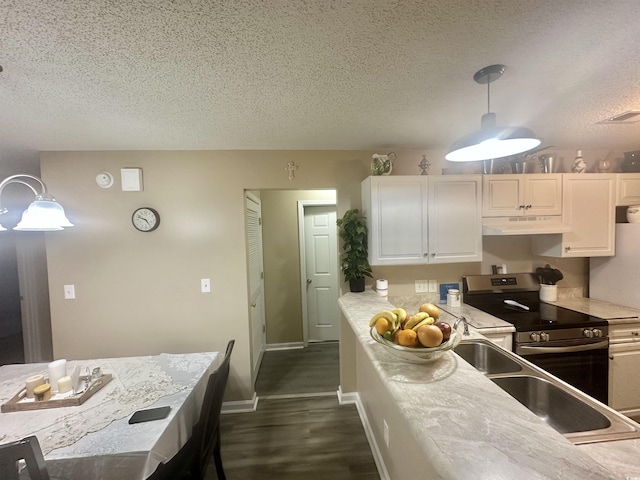 kitchen with white cabinetry, dark hardwood / wood-style flooring, stainless steel range with electric stovetop, hanging light fixtures, and a textured ceiling