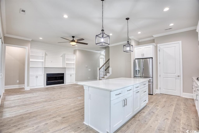 641 Waterbridge Blvd, Myrtle Beach, SC 29579 - kitchen with stainless steel fridge, ceiling fan, recessed lighting, white cabinets, and hanging light fixtures