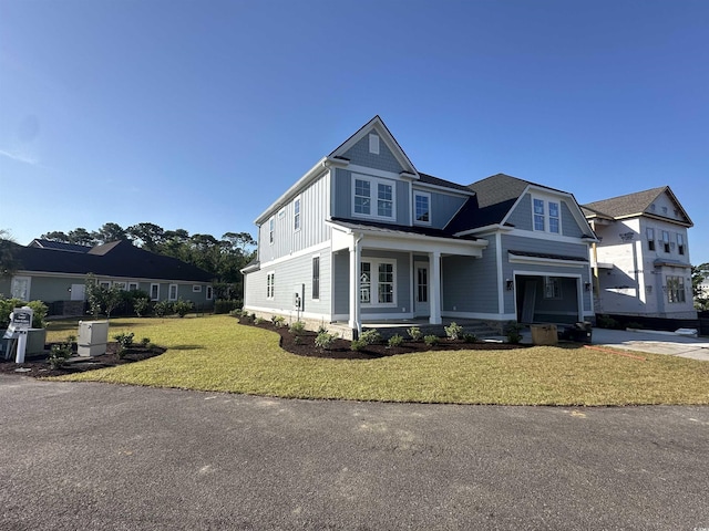 641 Waterbridge Blvd, Myrtle Beach, SC 29579 - view of front of property with a front lawn, covered porch, and board and batten siding