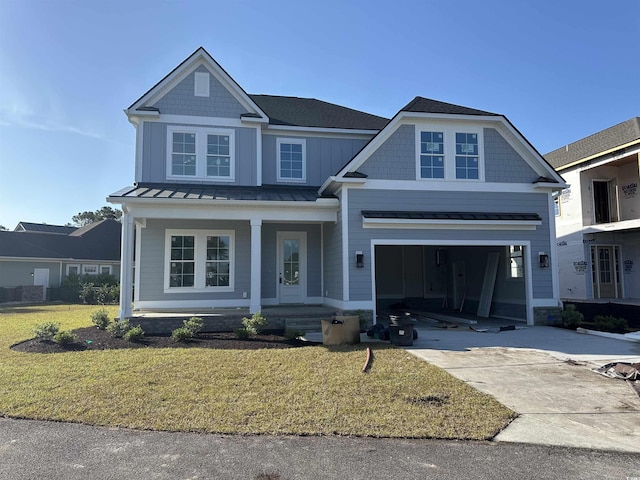 craftsman house with a front lawn, a garage, a porch, concrete driveway, and a standing seam roof