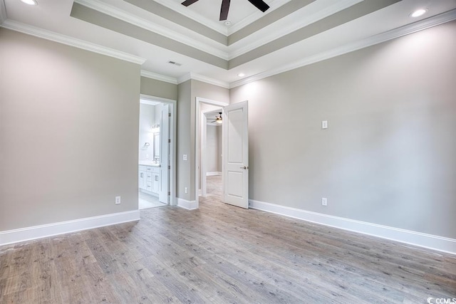 641 Waterbridge Blvd, Myrtle Beach, SC 29579 - spare room with ceiling fan, a tray ceiling, ornamental molding, light wood-type flooring, and baseboards