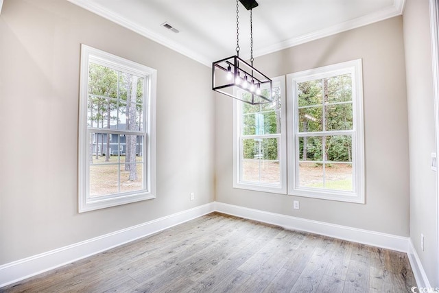 641 Waterbridge Blvd, Myrtle Beach, SC 29579 - unfurnished dining area with crown molding, wood finished floors, baseboards, and a chandelier