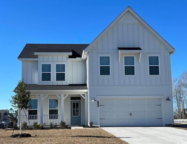 modern farmhouse style home with board and batten siding, driveway, and an attached garage