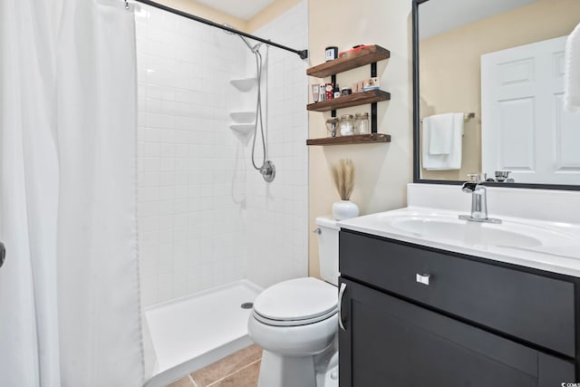 bathroom featuring curtained shower, vanity, toilet, and tile patterned floors