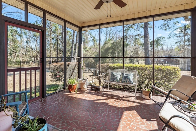 sunroom / solarium with ceiling fan