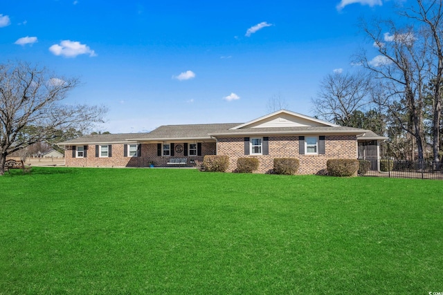 ranch-style home featuring a front yard