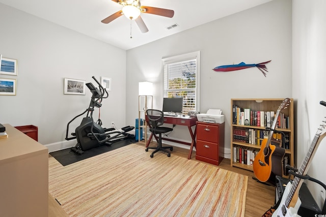 office space featuring hardwood / wood-style floors and ceiling fan